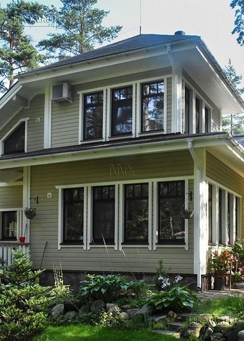 Построенный двухэтажный каркасный коттедж в комаровском стиле в п Комарово