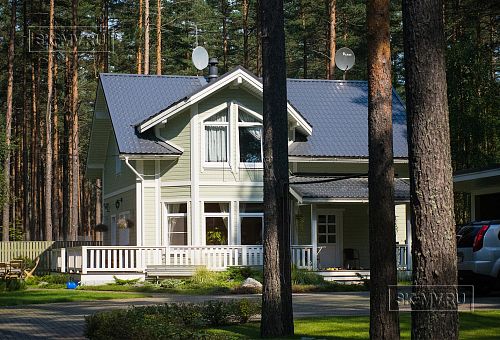 Построенный каркасный дом с комбинированной фасадной отделкой кирпичом и вагонкой в п Комарово - 8