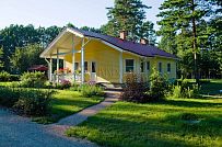 Строительство одноэтажного каркасного дома 95 кв м с фасадной отделкой желтой отделочной доской в г. Приозерск - мини - 1